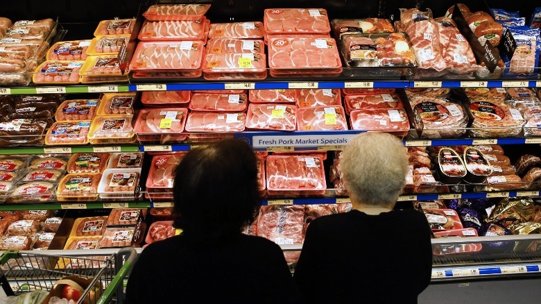 Shoppers browsing meat in Walmart store