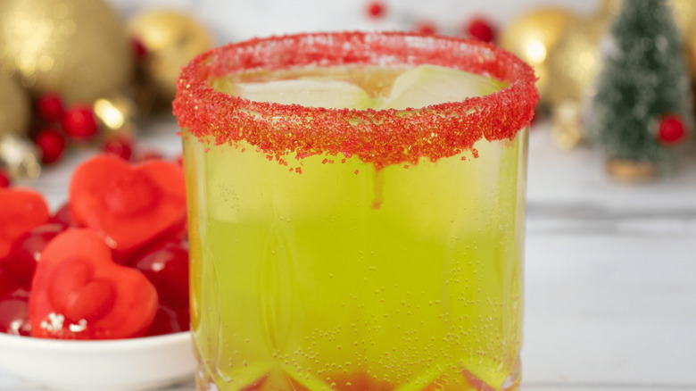 Grinch cocktail with red sugar rim