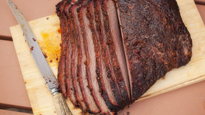 sliced brisket on cutting board