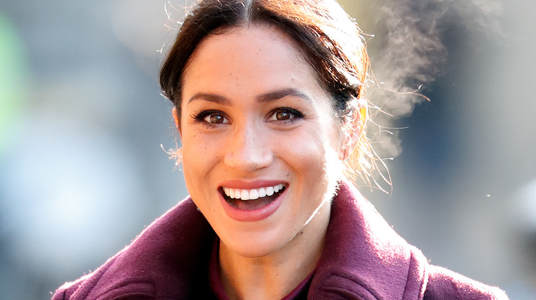 Meghan Markle in purple coat