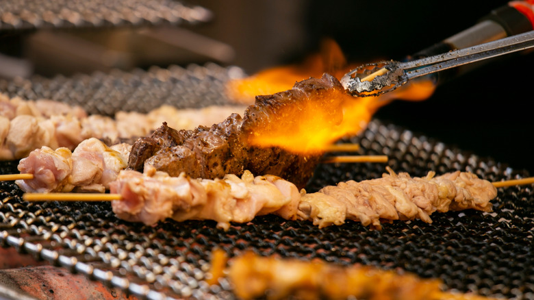 Grilled yakitori chicken skewers on grill