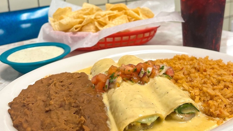 enchilada platter with rice and beans