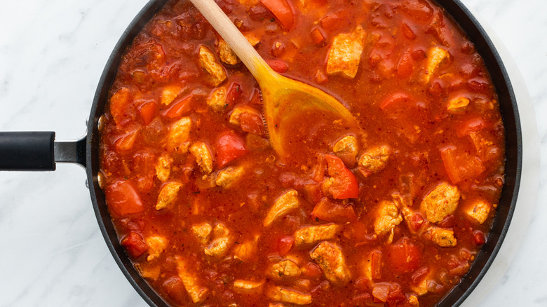 chicken simmering in stew