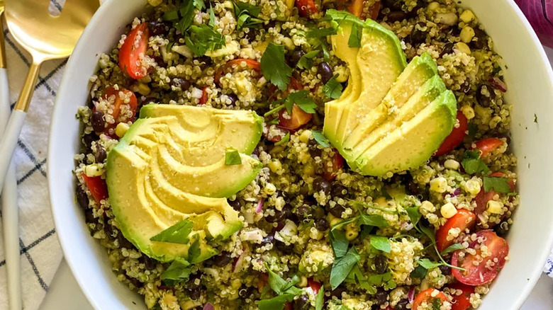 Bowl of quinoa, tomatoes, and avocado