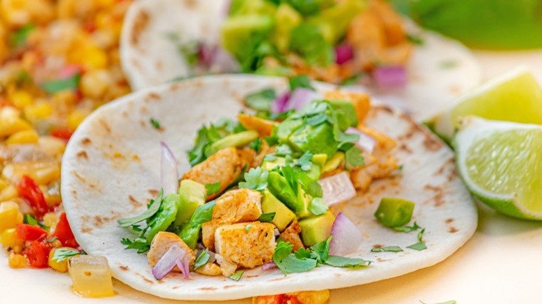 Soft taco with chicken and cilantro