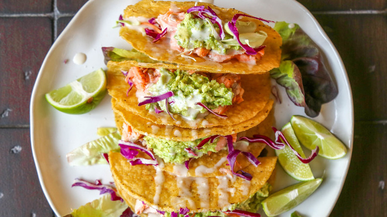 Hard tacos with salmon and avocado