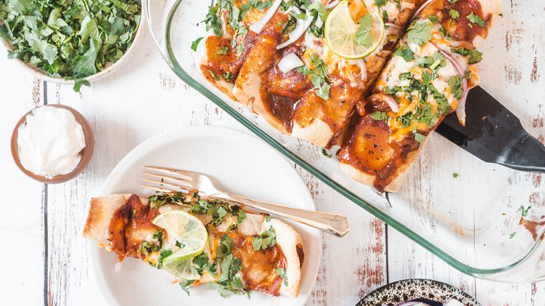 Baked enchiladas in pan and on plate