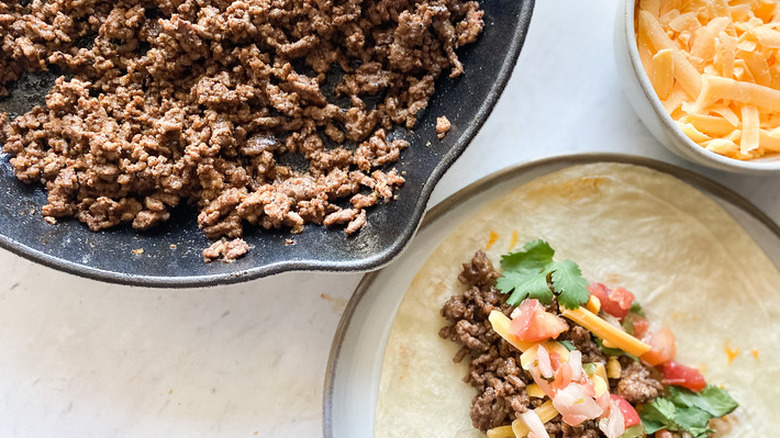 Pan of ground beef with tortillas