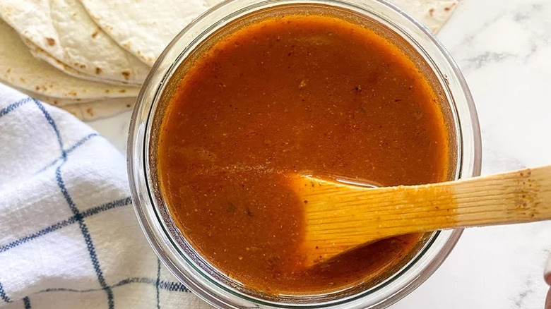 Glass bowl of red tomato sauce