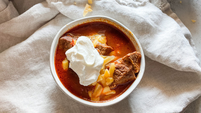 Small bowl of beef and cheese chili