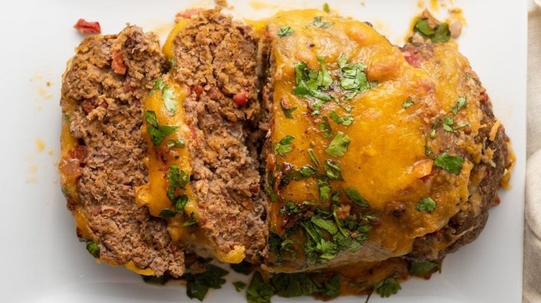 Sliced cheese-topped meatloaf