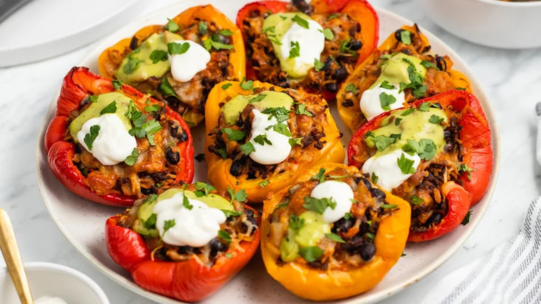 Platter of red and orange stuffed peppers