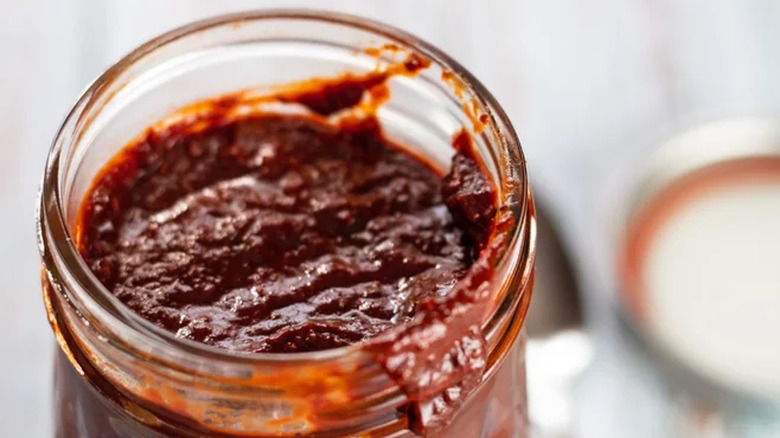 Jar of thick, red mole sauce