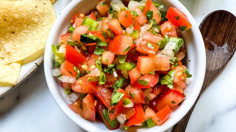 White bowl of fresh tomato salsa