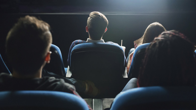 Audience in movie theater seats