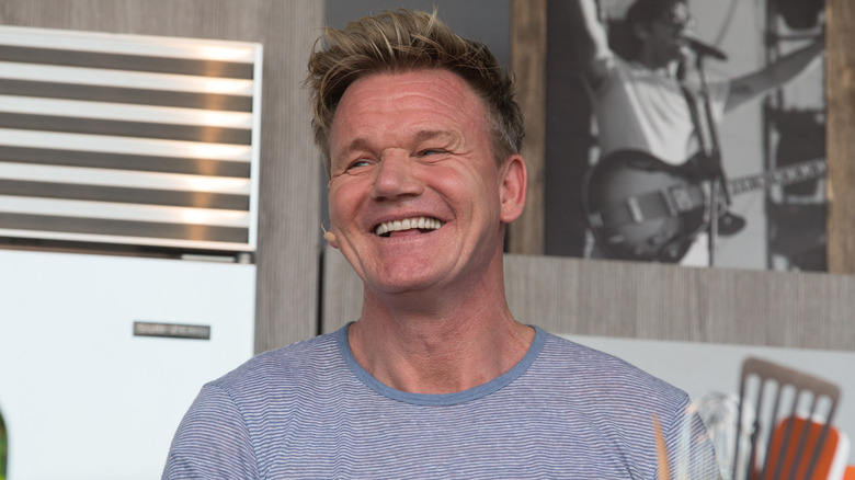 Gordon Ramsay smiling in a striped shirt