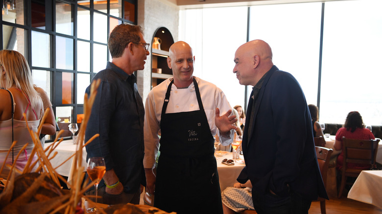 Michael Symon and other chefs judge a competition