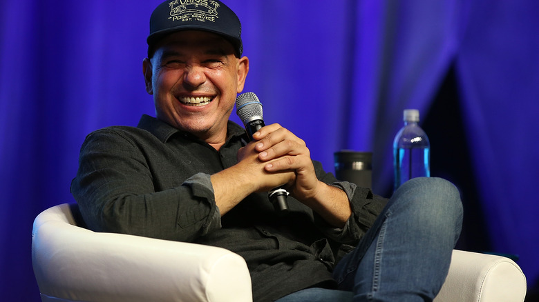 Michael Symon smiling with microphone