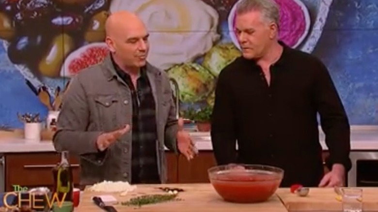 Ray Liotta and Michael Symon cooking