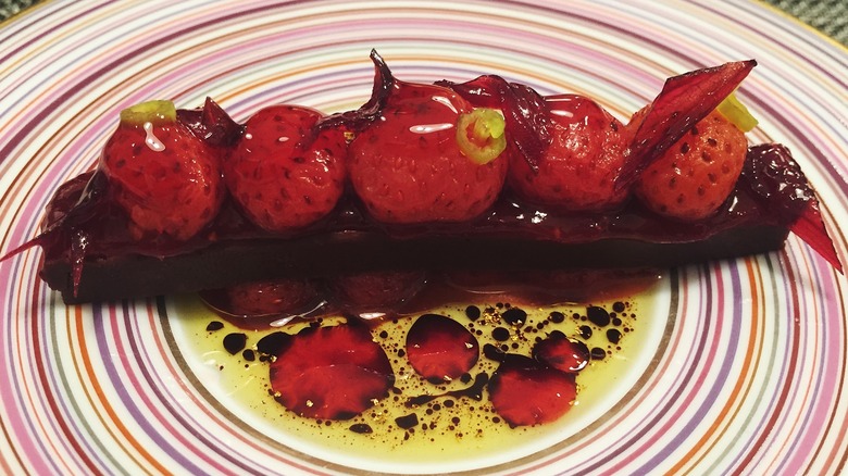 Close up of a strawberry dessert on a striped plate