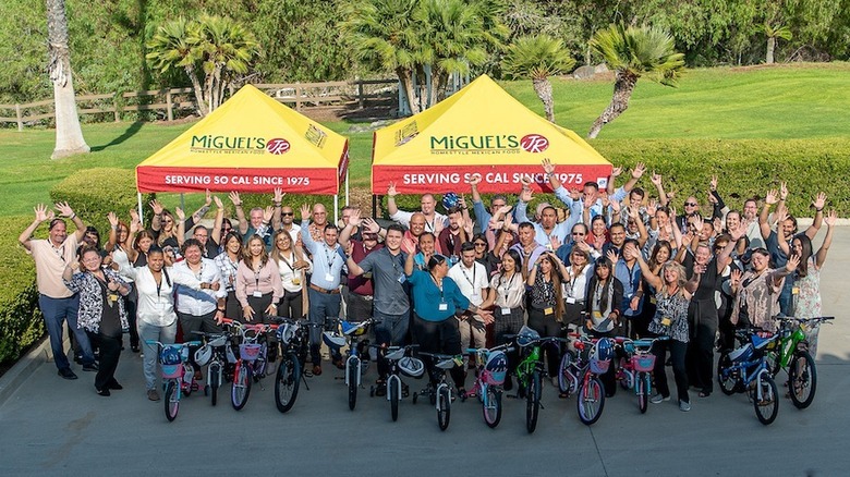 Miguel's Jr.'s employees with kids' bikes