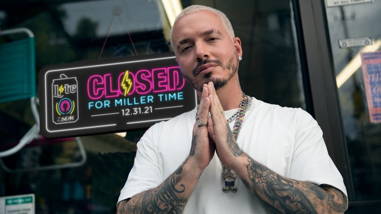 J Balvin in front of Miller Time sign