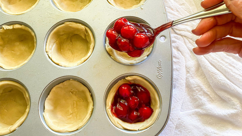 filling the mini cherry pies