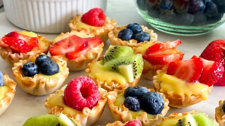 Finished tarts and bowls of fruit