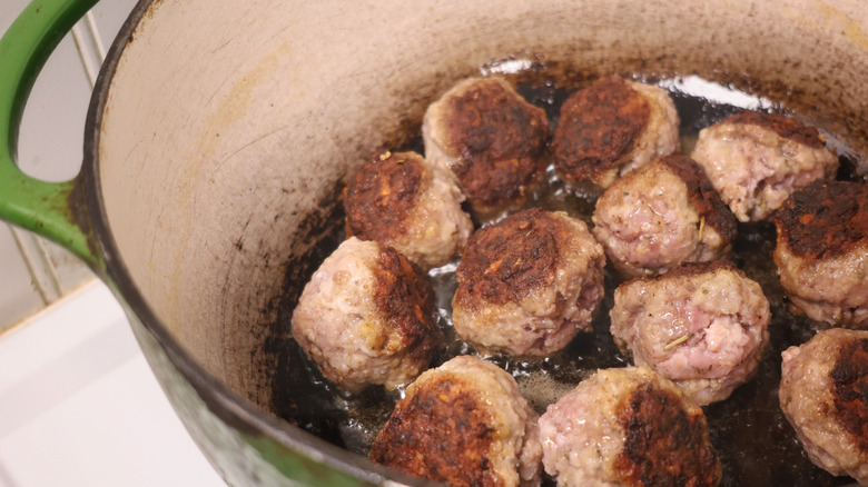 pot of cooking meatballs