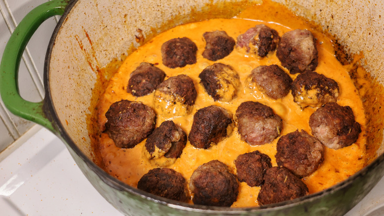 meatballs in pot of vodka sauce