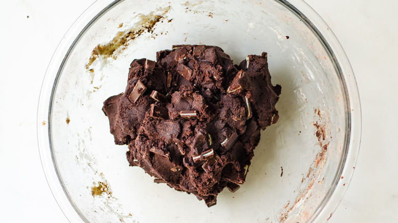 Cookie dough sits in a clear bowl