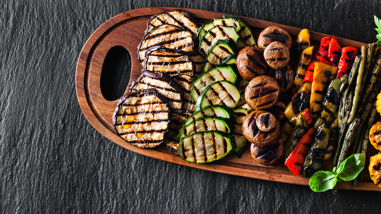 Grilled veggies on a wooden tray