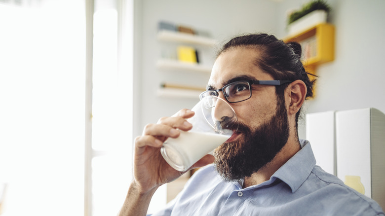 man drinking milk