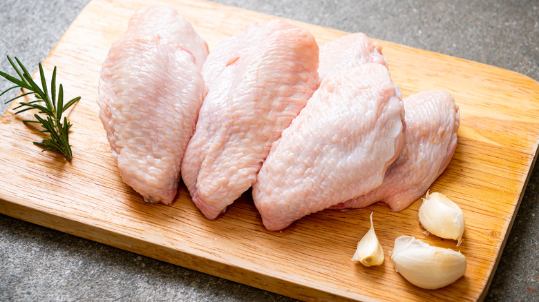 raw chicken on cutting board