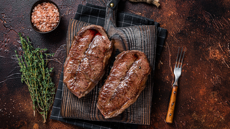 Two steaks on with herbs