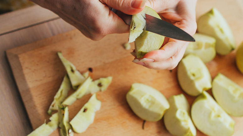 Woman cutting apples