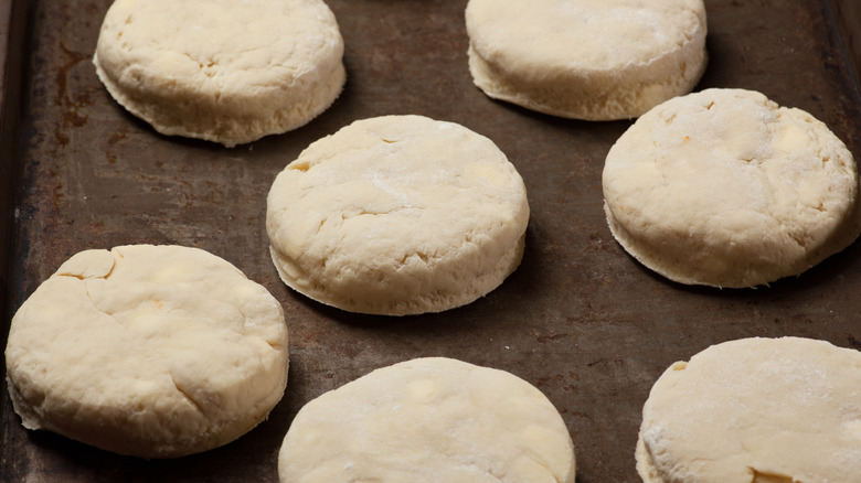 Uncooked biscuits on a baking sheet