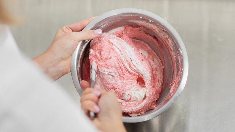 mixing pink macaron batter