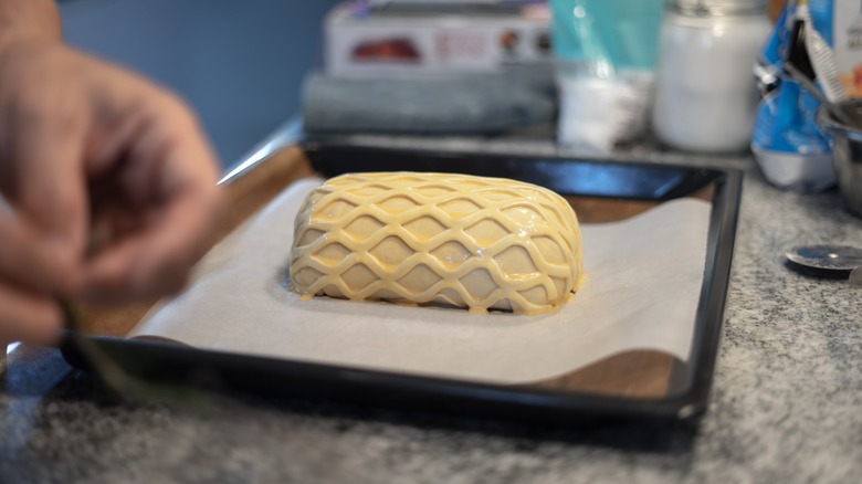 Unbaked beef Wellington on tray