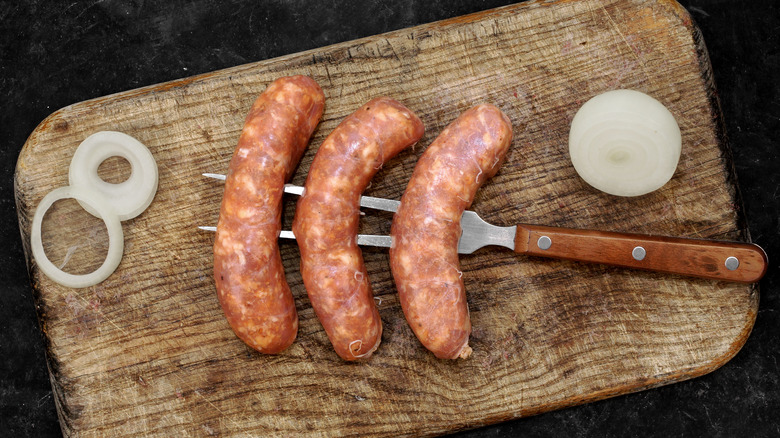 Fresh sausage on fork