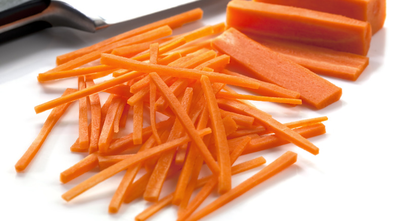 julienned carrots with knife