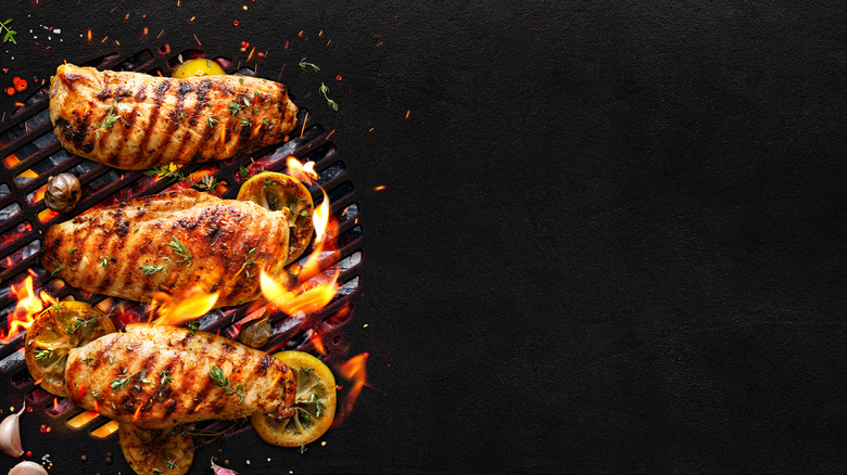 Chicken on flaming grill