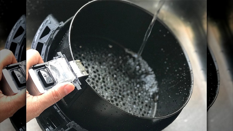 air fryer basket in water