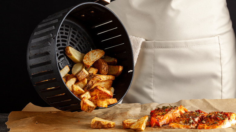 Potato fries in an air fryer basket