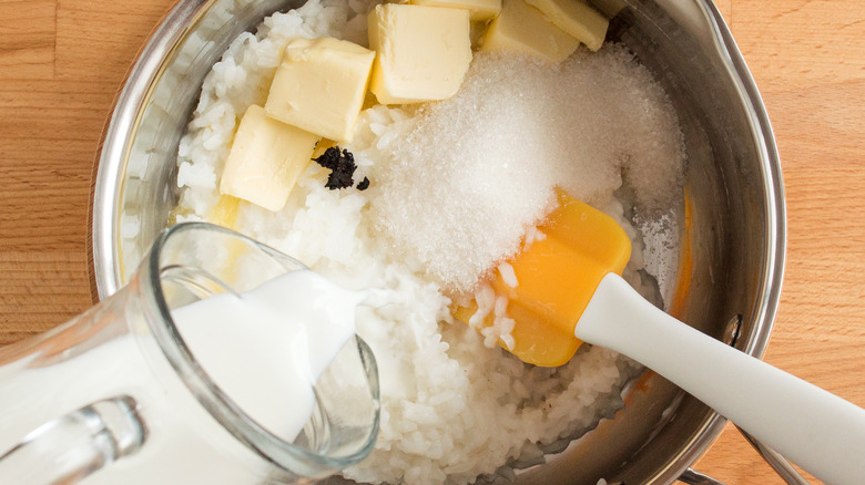 stirring rice with sugar and butter and cream