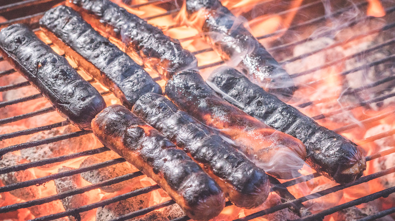 burnt sausages on grill