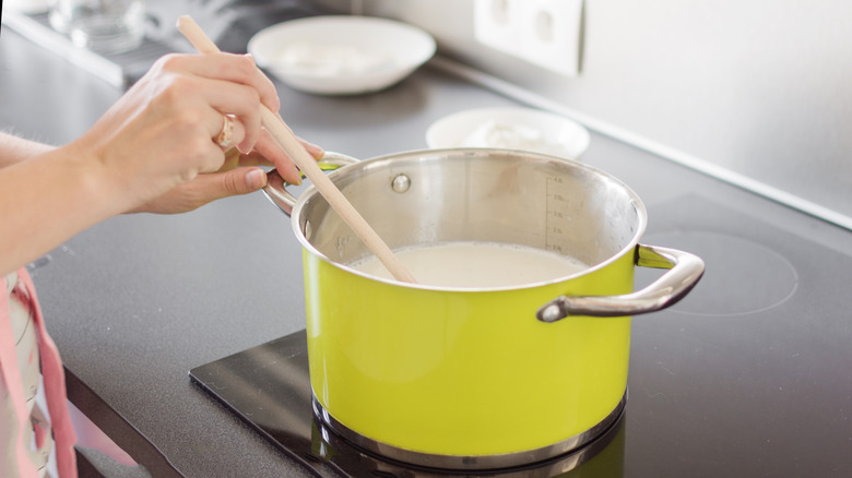 stirring cream on stove