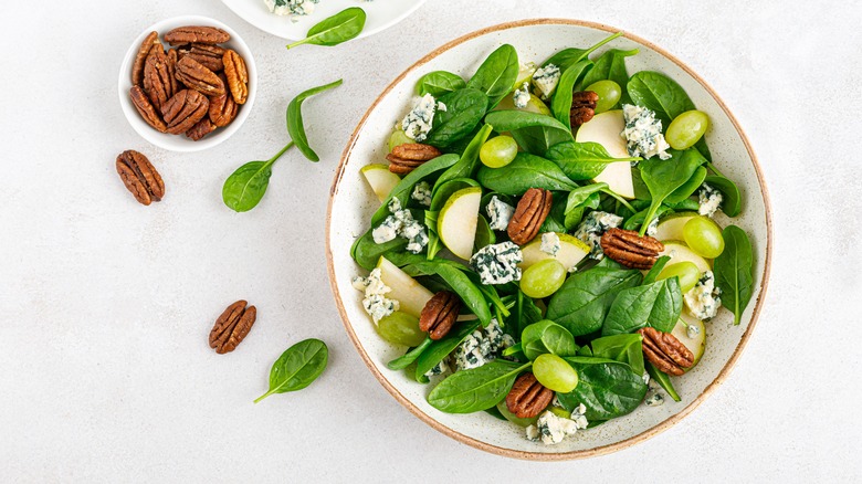 Green salad with cheese, pecans, and fruit