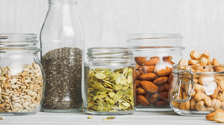 Nuts and seeds in glass jars