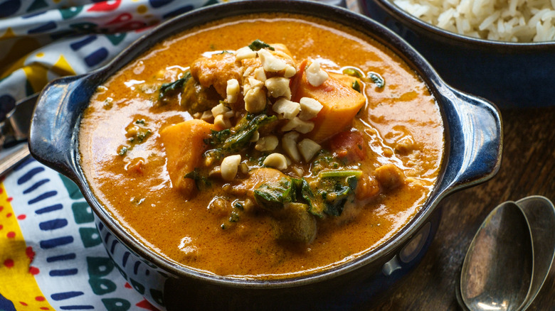 African peanut stew in a black pot